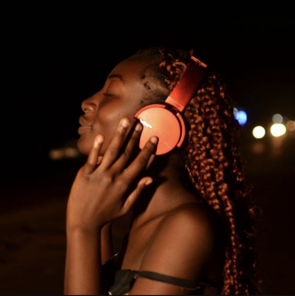 Portrait with headphones at night